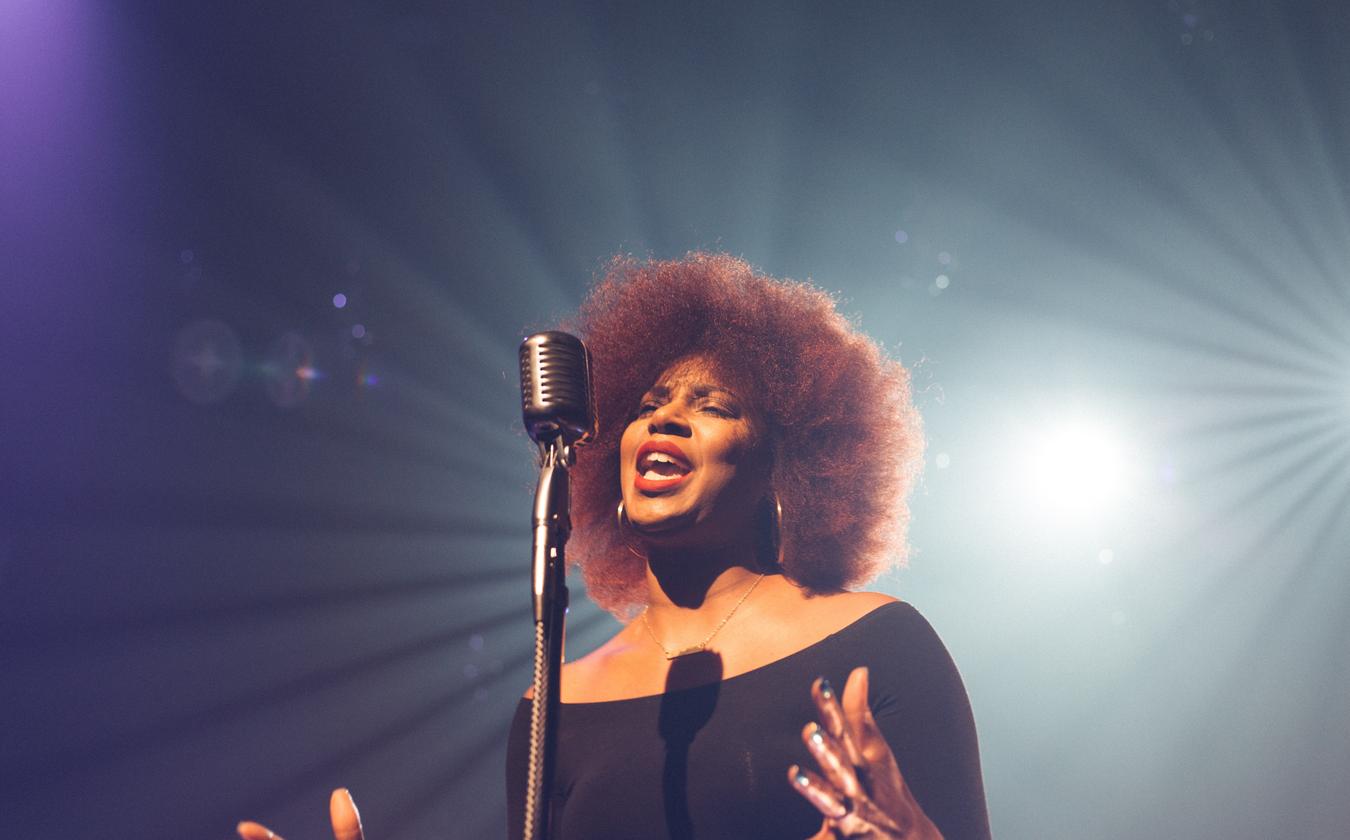 Woman Singing in the Mic